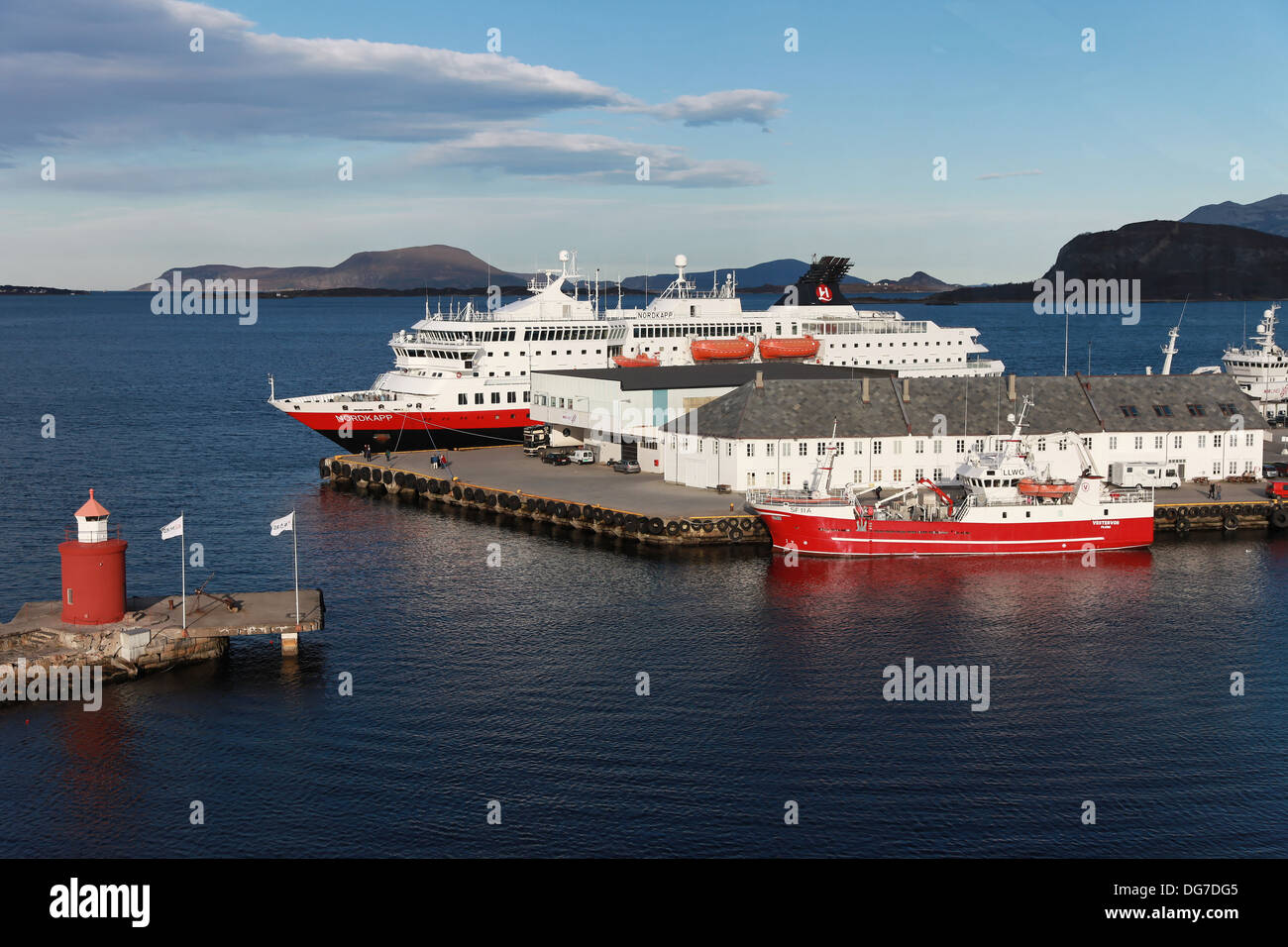 Hurtigruten ship MS Nordkapp on a stopover at the Pier of Alesund, Province of Moere and Romsdal, West Norway on a sunny day Stock Photo