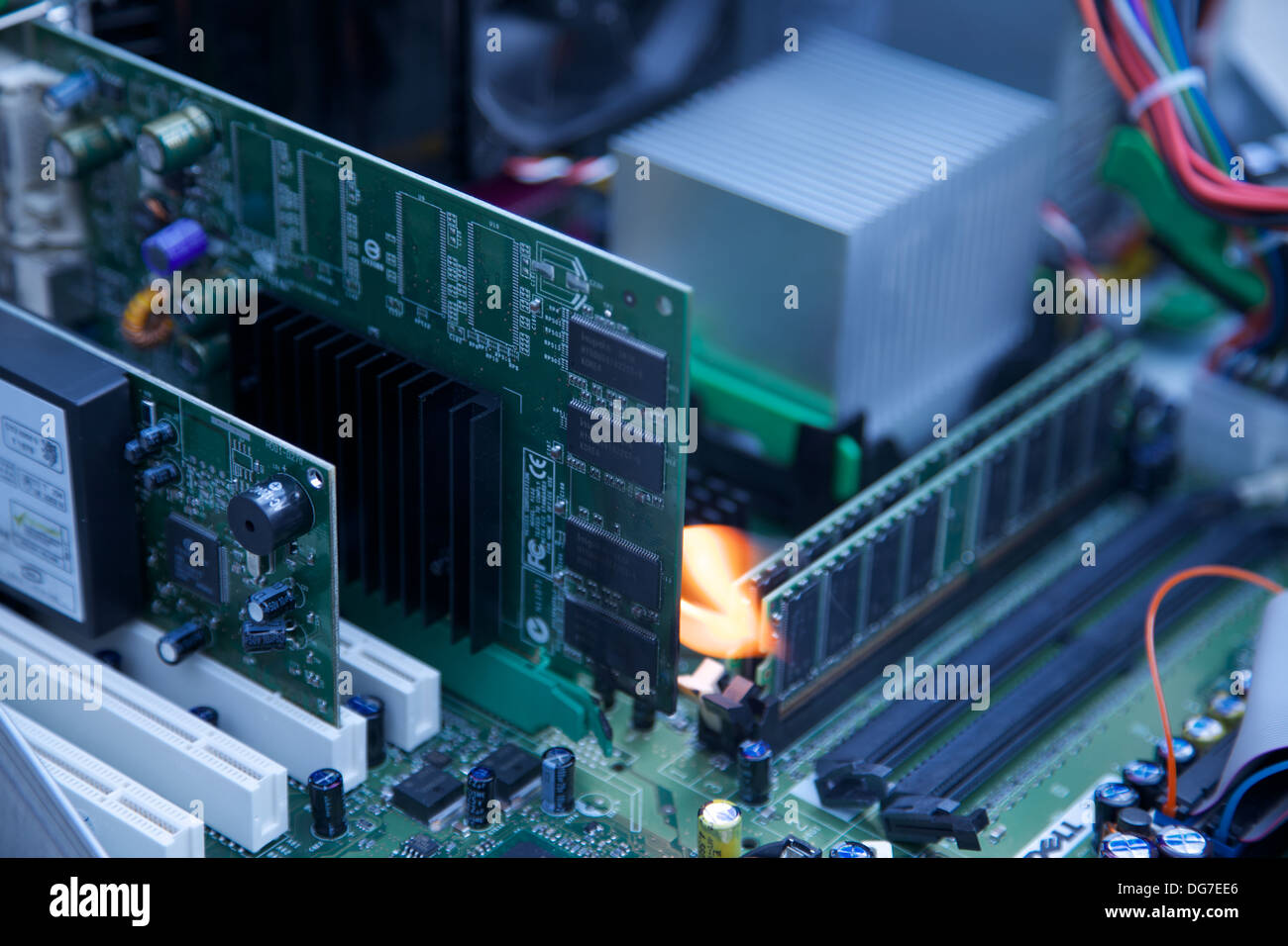 Over heating circuit board leading to a fire. Stock Photo
