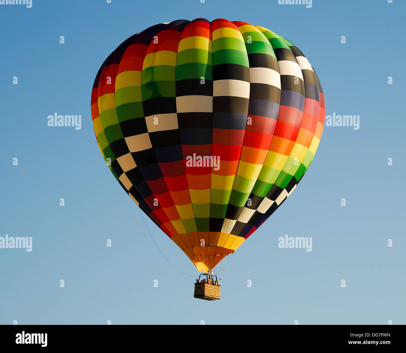 A colorful hot air balloon against a blue sky Stock Photo - Alamy