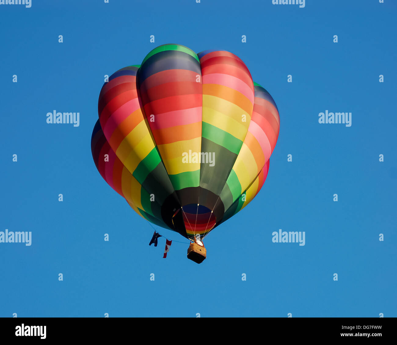 A colorful hot air balloon against a deep blue sky Stock Photo - Alamy