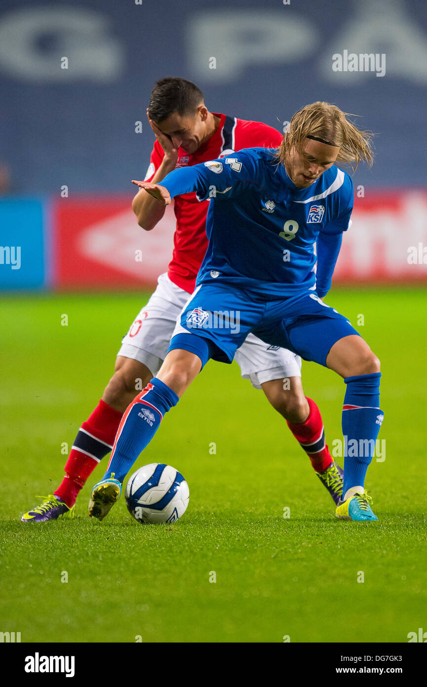 Oslo, Norway. 15th Oct, 2013. Birkir Bjarnason of Iceland holds of a challenges from Omar Elabdellaoui of Norway during. the 2014 FIFA World Cup UEFA Group E qualifying match between Norway and Iceland at the Ullevaal Stadion in Oslo, Norway. © Action Plus Sports/Alamy Live News Stock Photo