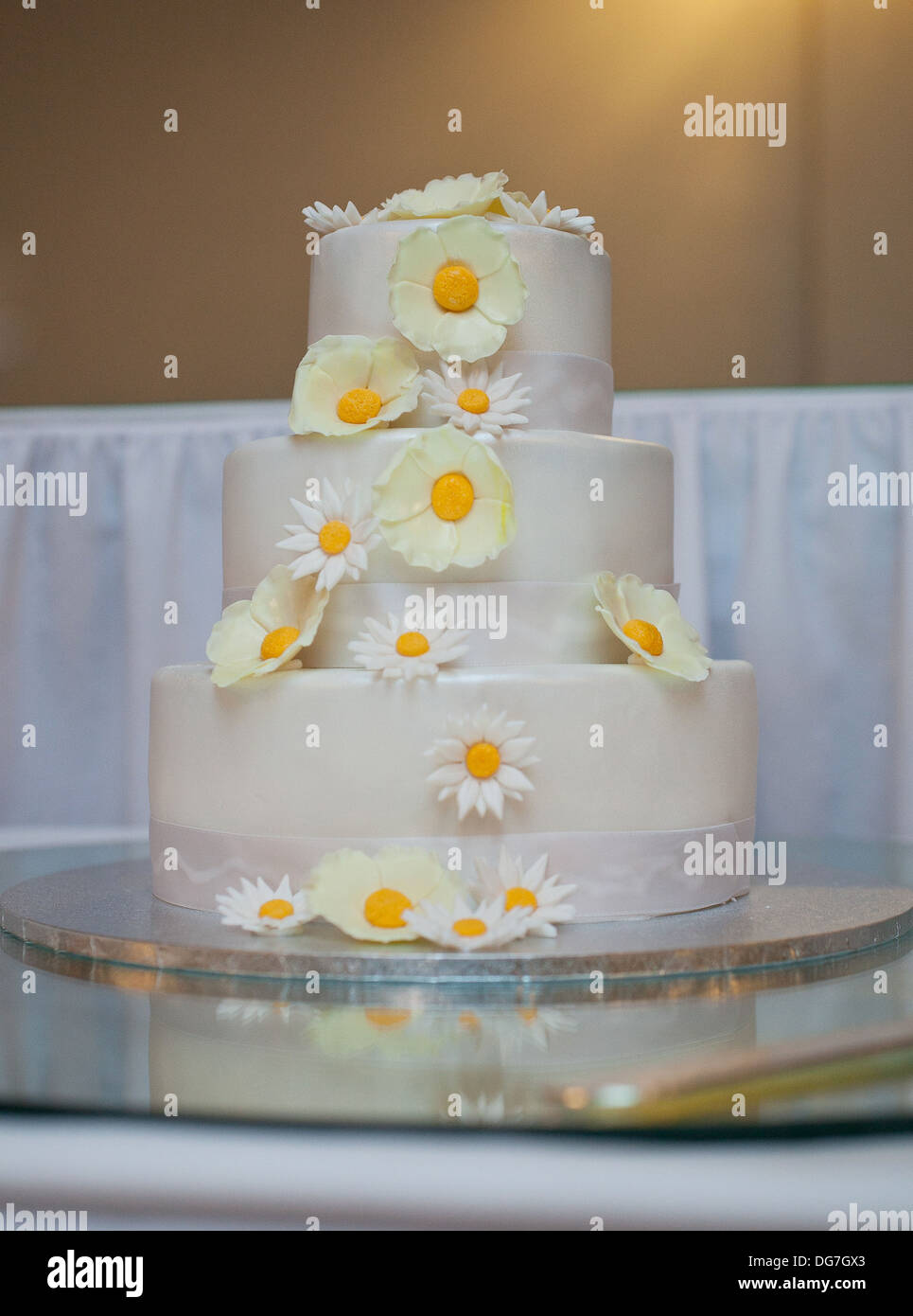 Wedding cake covered with flowers Stock Photo - Alamy