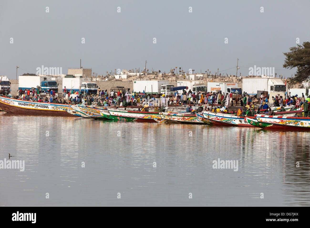 Senegal, Saint Louis. Refrigerated Trucks Lined up to Buy and Carry Fishermen's Catch to Inland Markets. Stock Photo