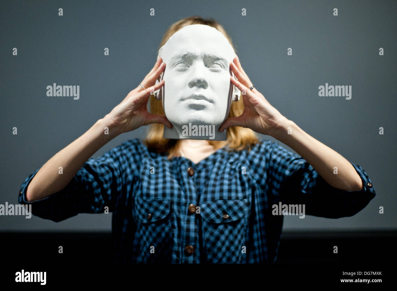 London, UK – 10 October 2013: Kathy Boyce holds a 3D printed head at the Inition, Everything in 3D demo studio in Shoreditch, East London. Stock Photo