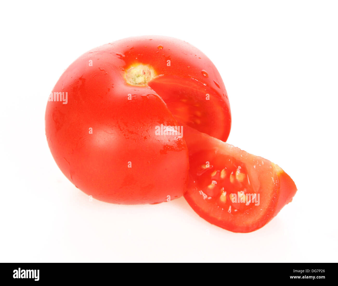 Tomato fruit with segment cut out Stock Photo Alamy