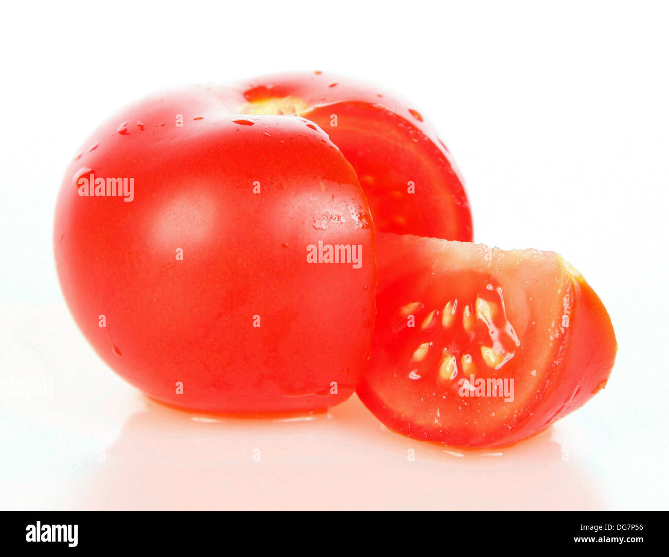 Tomato fruit with segment cut out Stock Photo Alamy