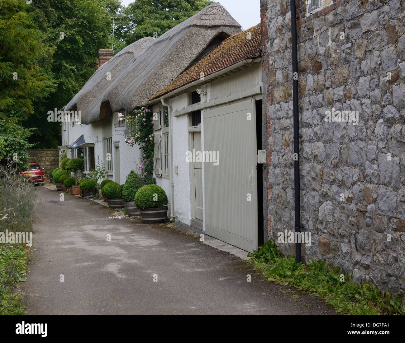 Typical Old English Country Cottages With Thatched Roof And