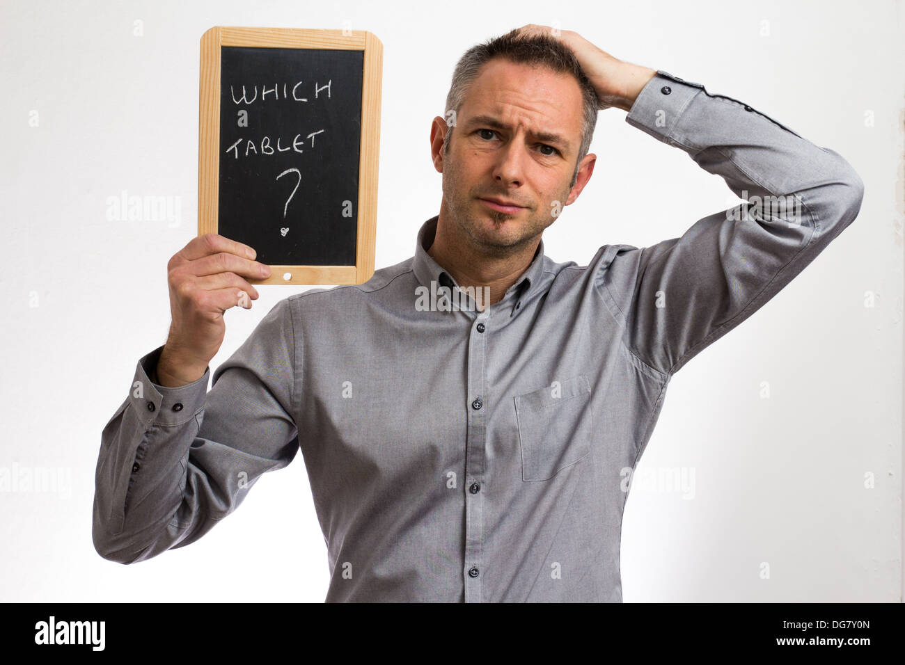 Confused Man Holding A Blackboard Tablet Stock Photo 61640453 Alamy