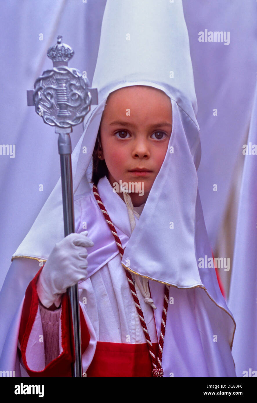 young penitent. Holy Thursday procession in Plaza San Miguel Bajo.Brotherhood of `AuroraÂ´. Granada. Andalusia, Spain Stock Photo