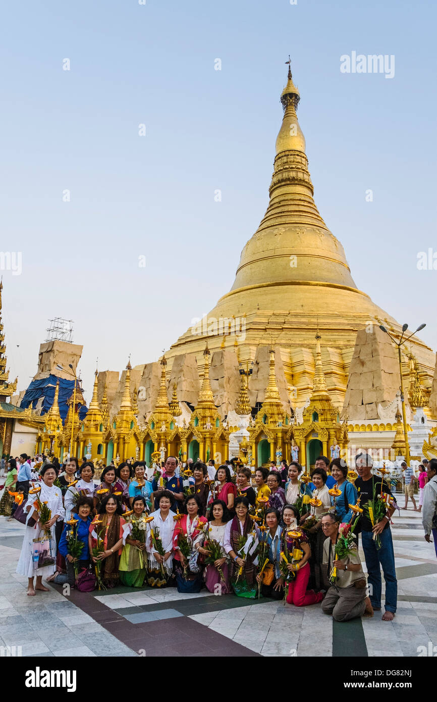 Believers at Shwedagon Pagoda, Yangon, Myanmar, Asia Stock Photo