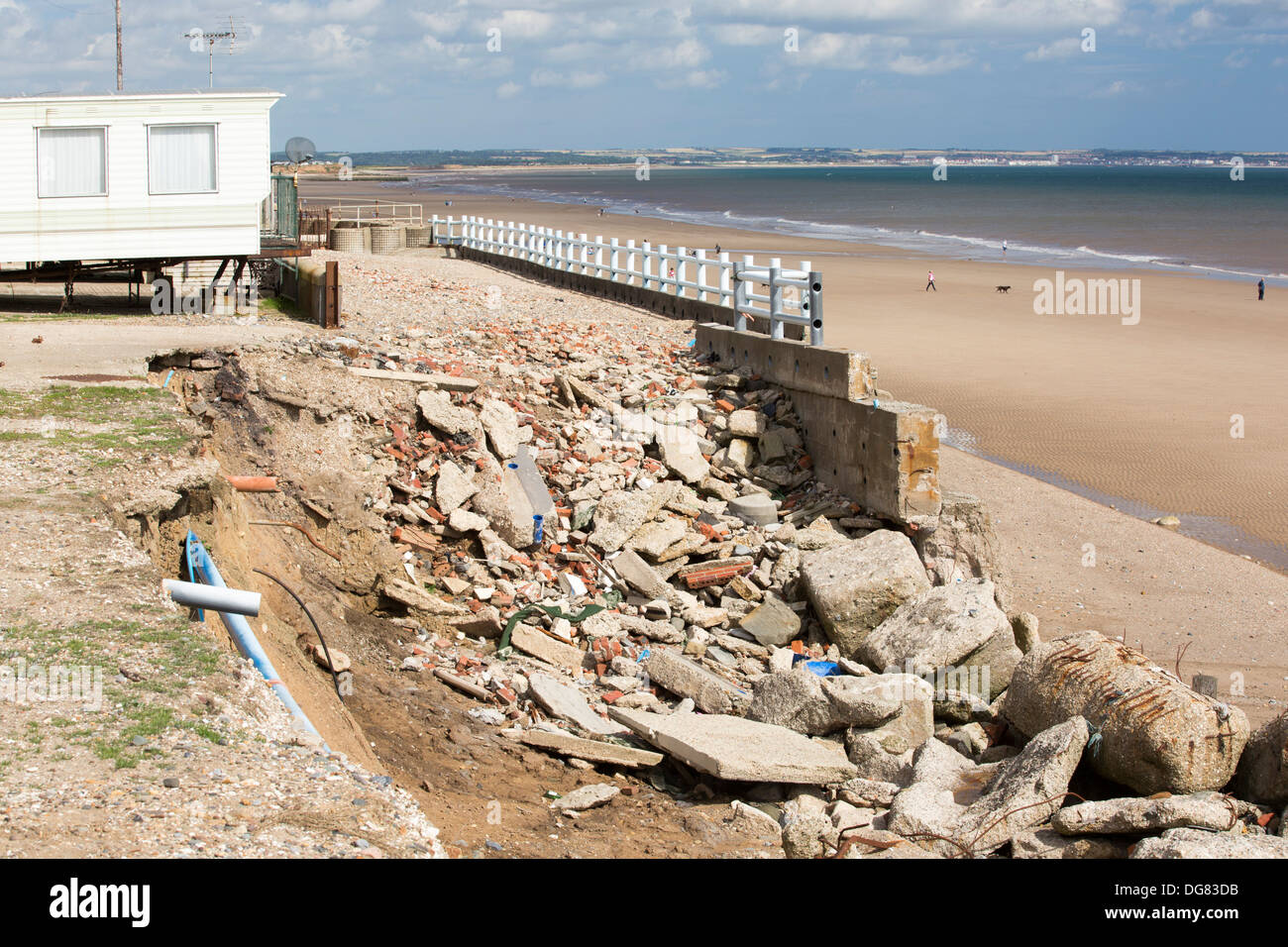 Smashed concrete sea defences at Beach Bank Caravan Park in Ulrome near Skipsea on Yorkshires East Coast, UK Stock Photo