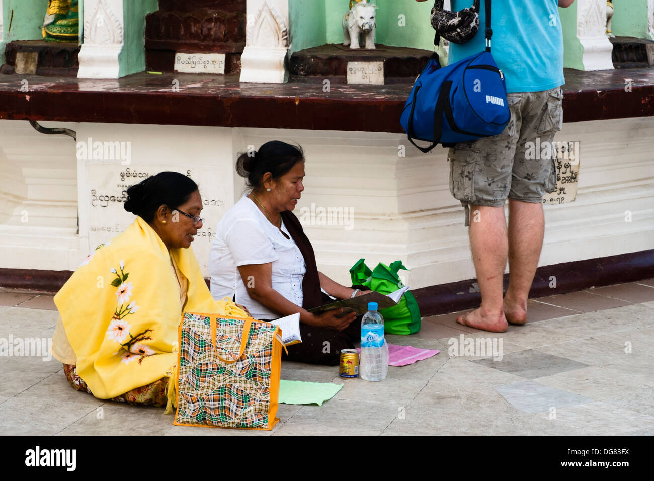 Praying women at Shwedagon Pagoda, Yangon, Myanmar, Asia Stock Photo