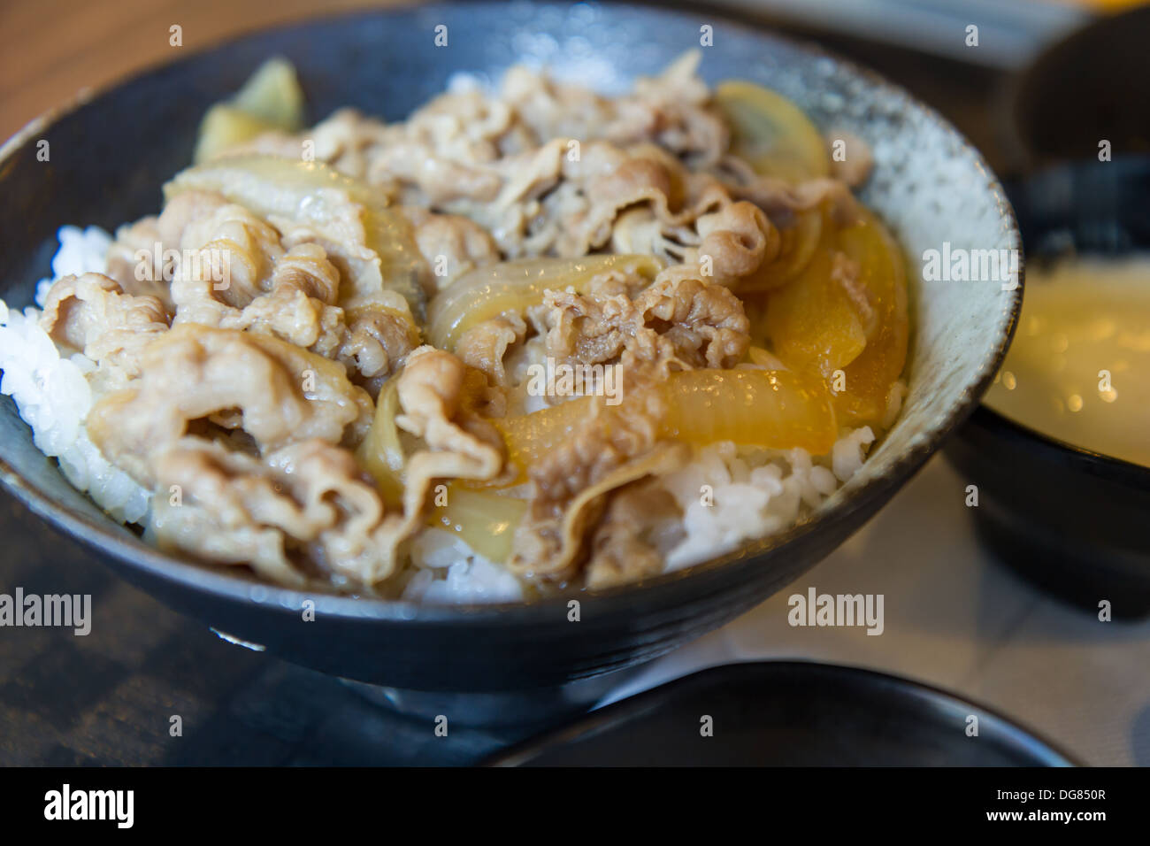 Japanese pork and rice in a black bowl Stock Photo