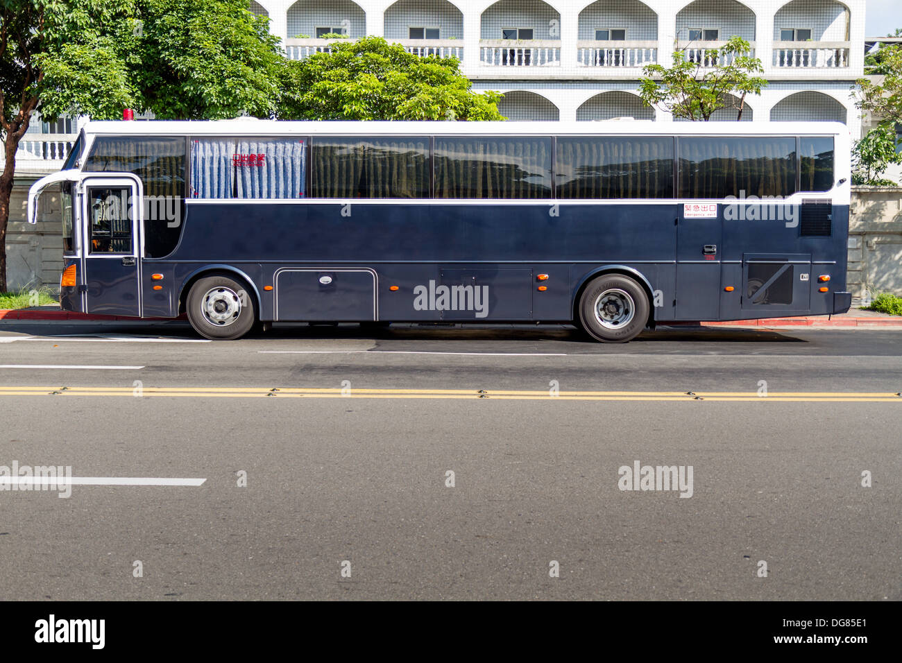 Blue and white Bus for prisoners parked Stock Photo