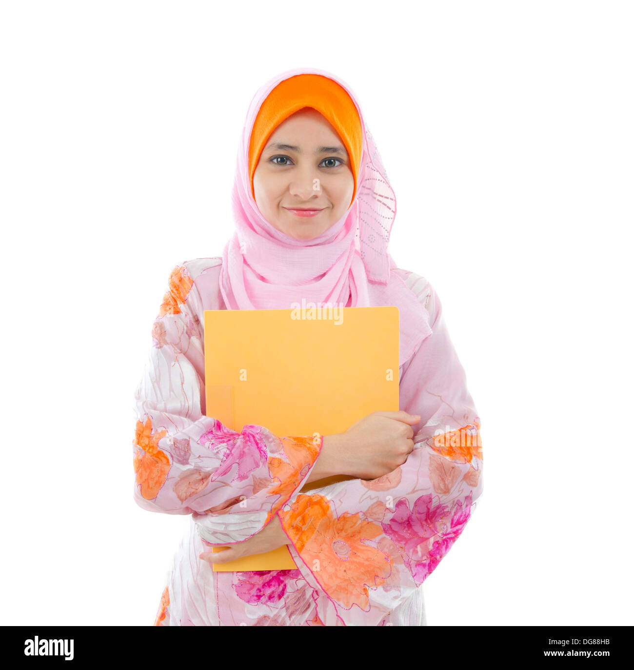 malay indonesian college girl holding a folder with white background Stock Photo