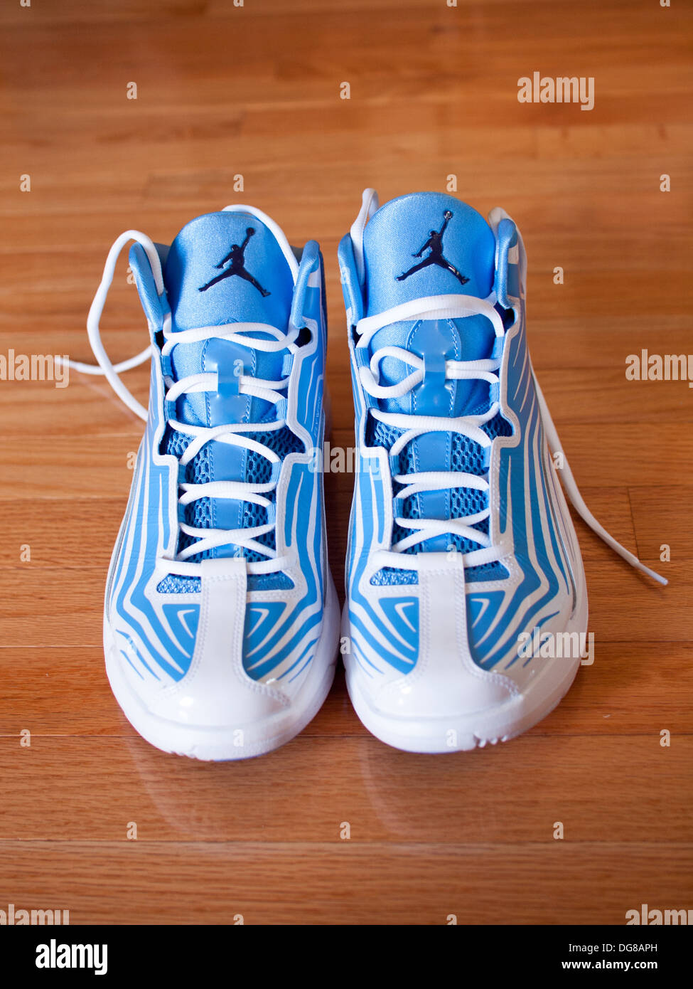 A pair of university blue, midnight navy and white Jordan Aero Mania men's basketball shoes. Stock Photo
