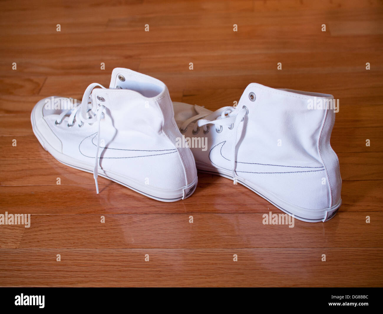A pair of white Nike Go Mid Canvas casual canvas sneakers, 2011 model. Stock Photo