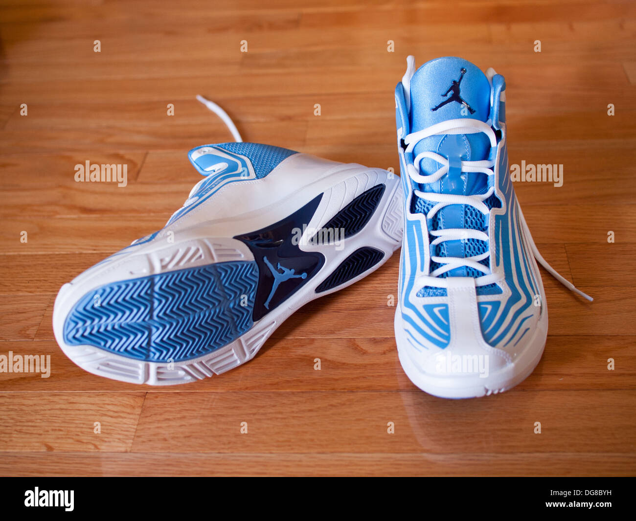 A pair of university blue, midnight navy and white Jordan Aero Mania men's basketball shoes. Stock Photo