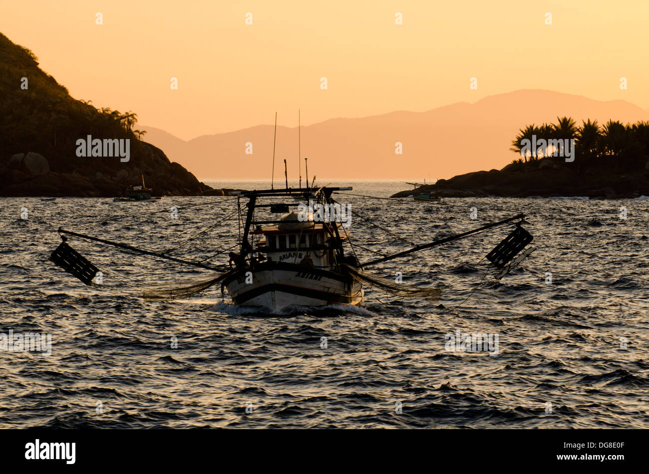 shrimp fishing boat anchored close to Vitoria island, Ilhabela, Sao Paulo SHore, Brazil Stock Photo