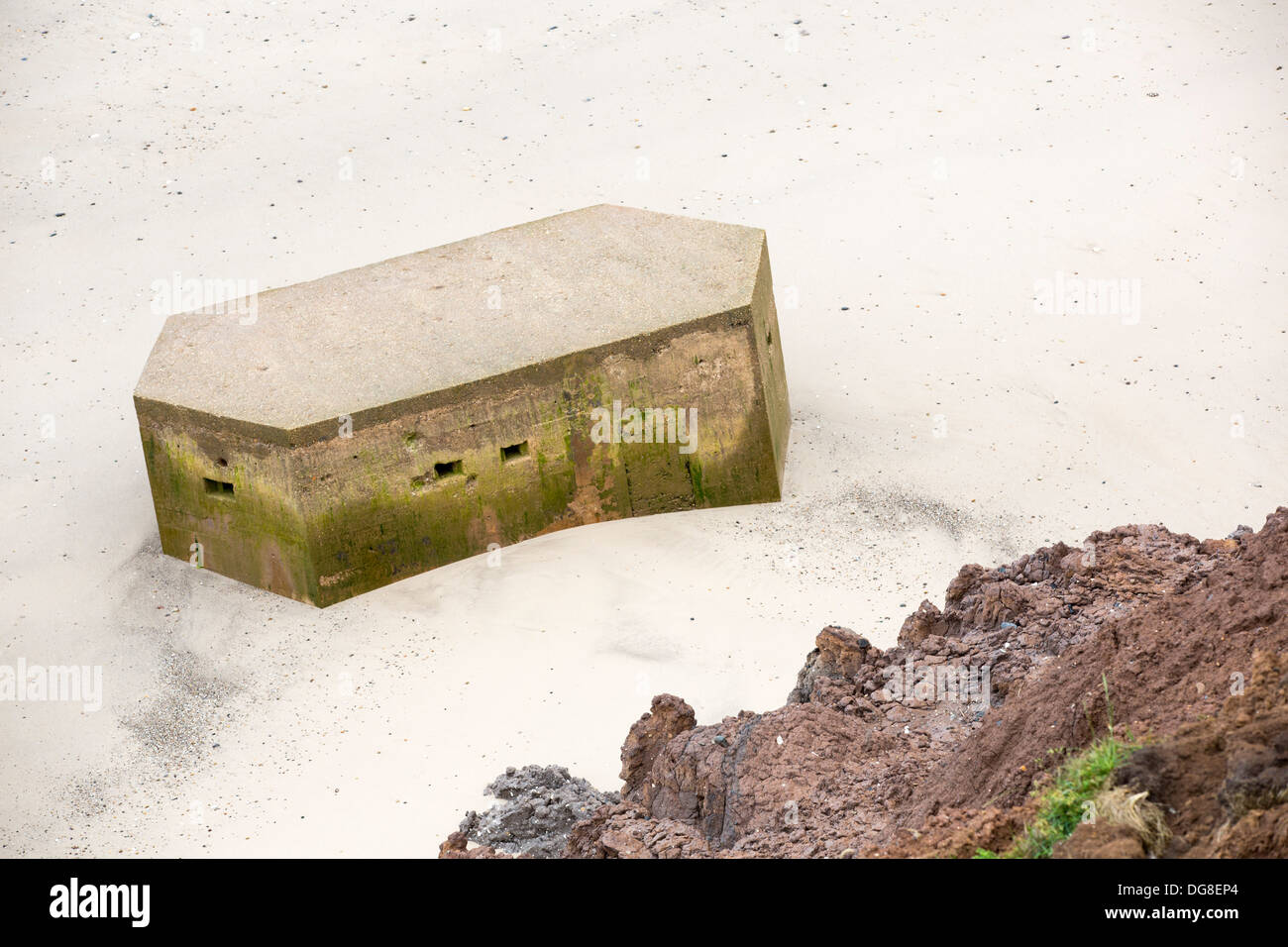 A Second world War Pill box on the beach near Aldbrough on Yorkshires East Coast, the fastest eroding coastline in Europe. Stock Photo