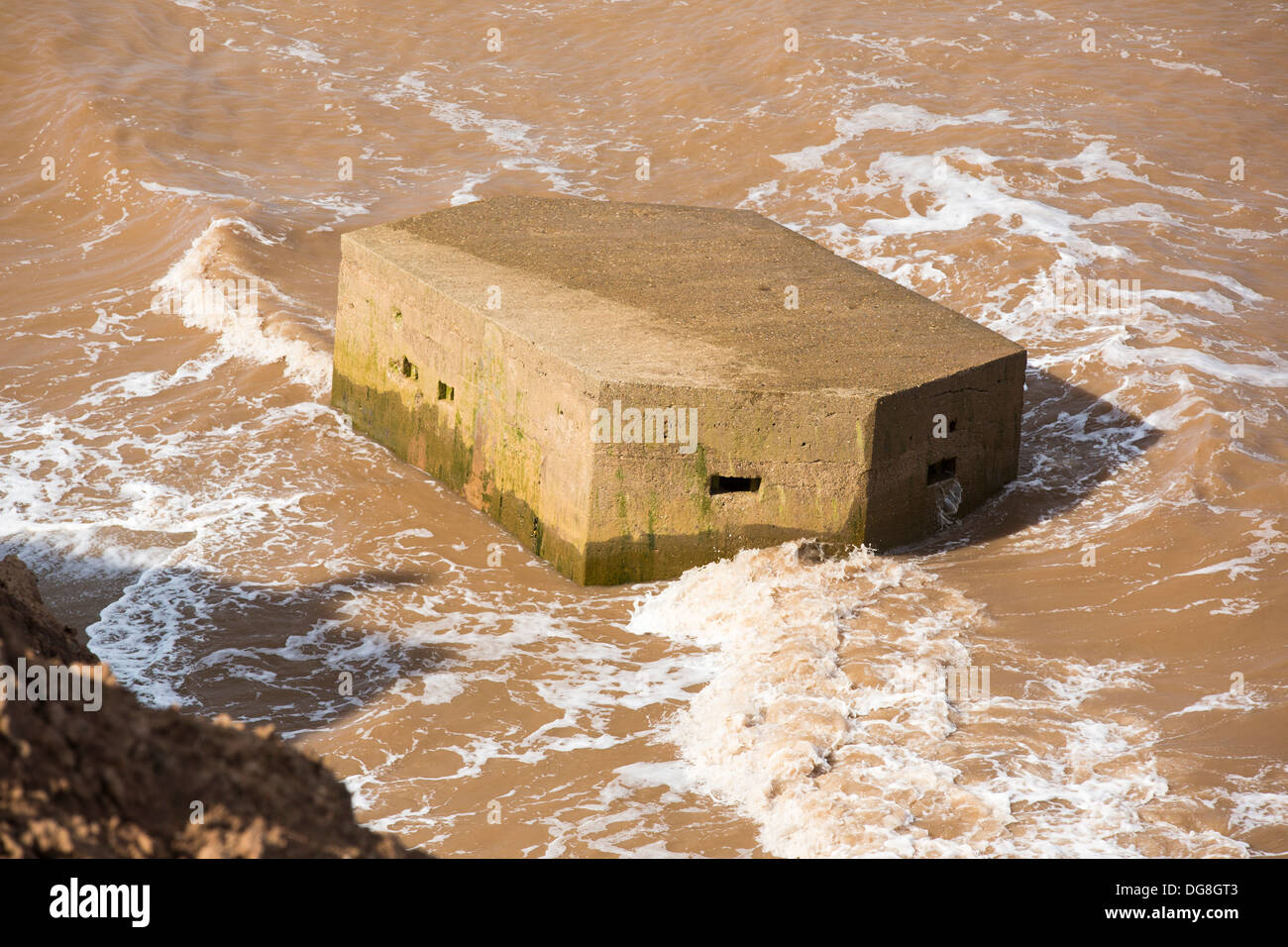 A Second world War Pill box on the beach near Aldbrough on Yorkshires East Coast after collapsing due to coastal erosion Stock Photo
