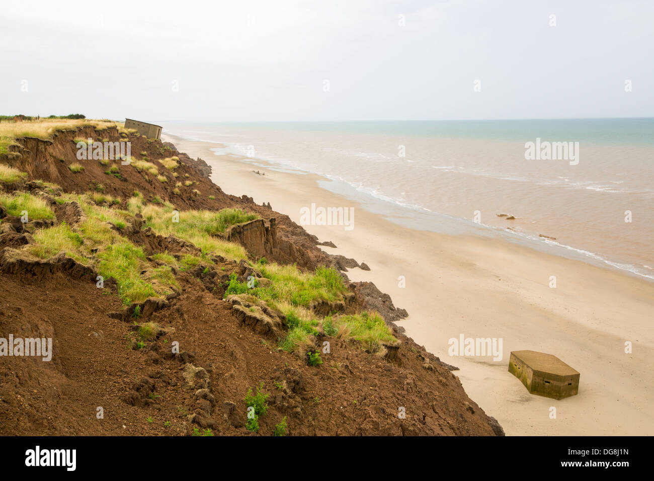 A Second world War Pill box on the beach near Aldbrough on Yorkshires East Coast after collapsing due to coastal erosion Stock Photo