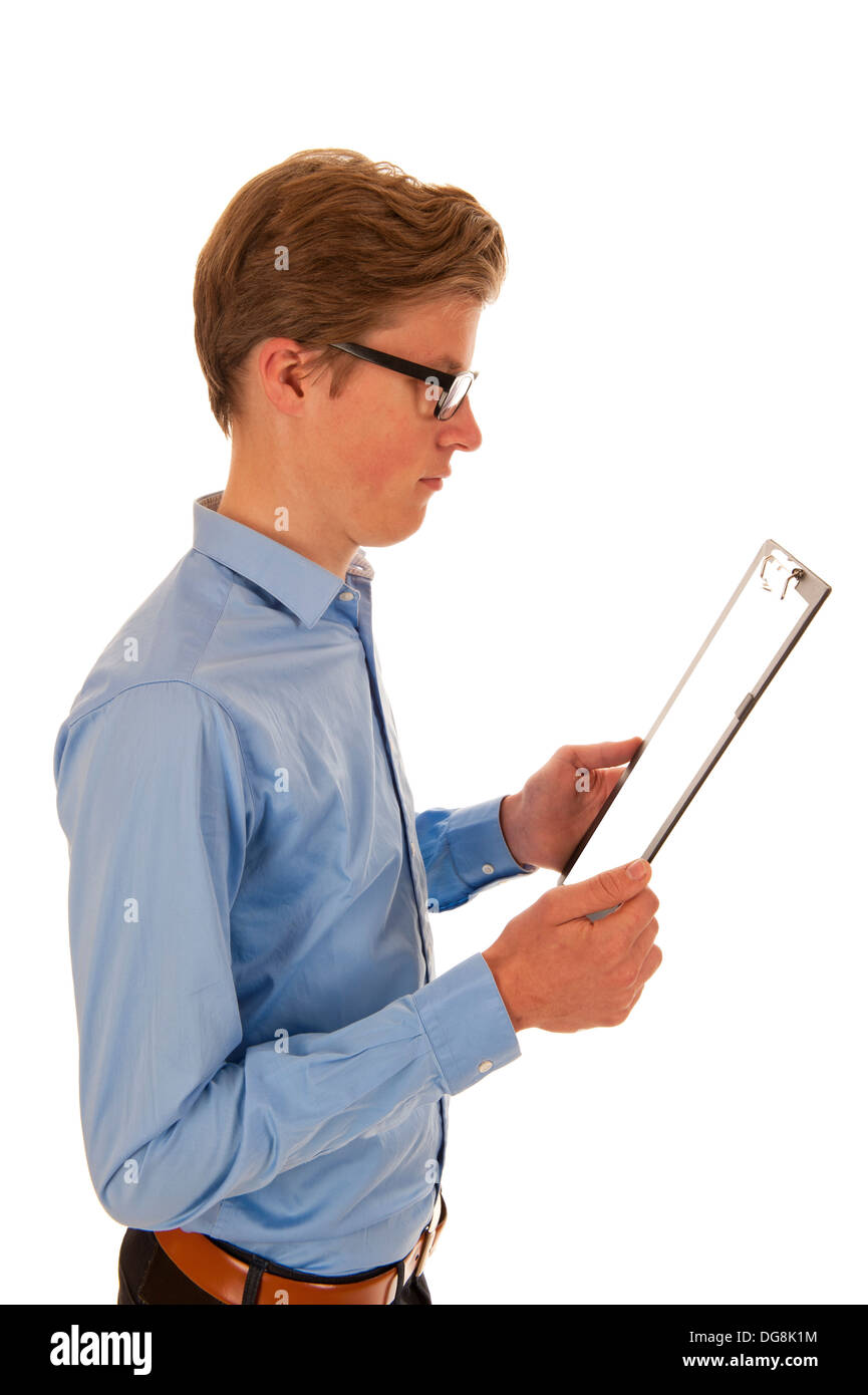 Man in blue shirt holding and reading from a black clipboard Stock Photo