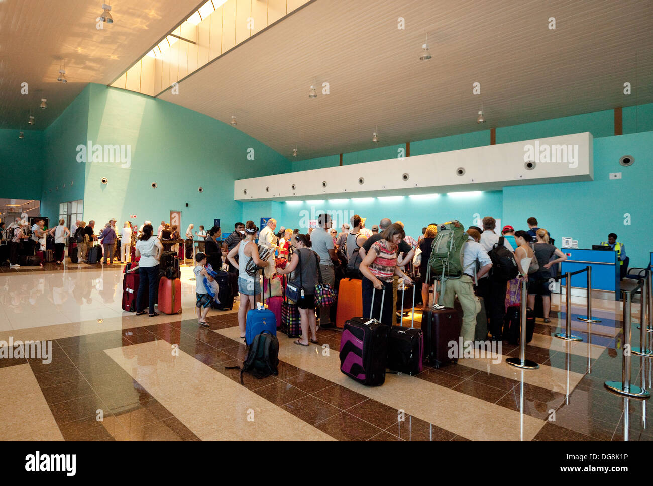Air passengers at the check in at an African airport; Livingstone airport, Zambia Africa Stock Photo