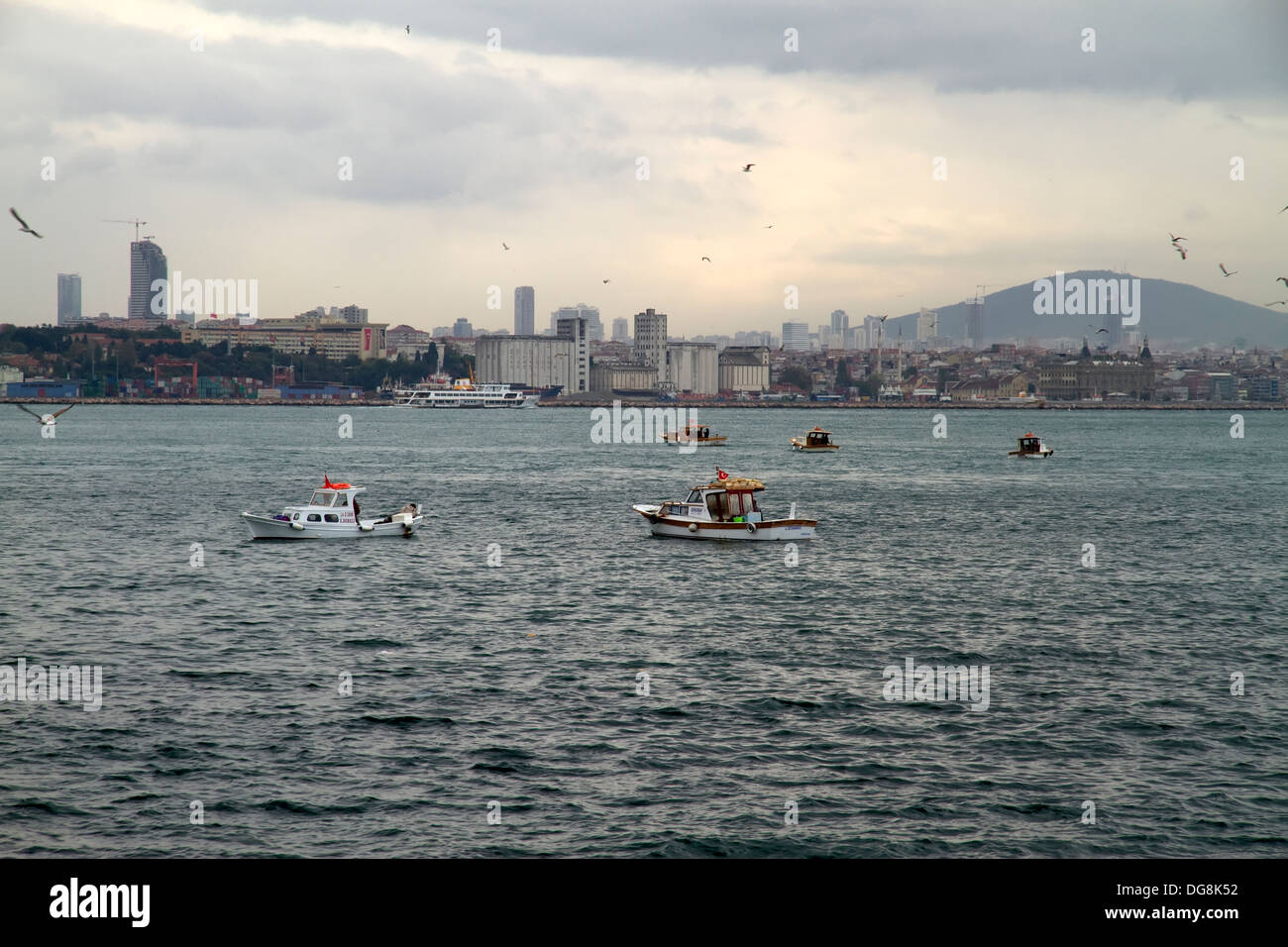 Local Fishing Boats at Istanbul Harbour in Turkey. Stock Photo