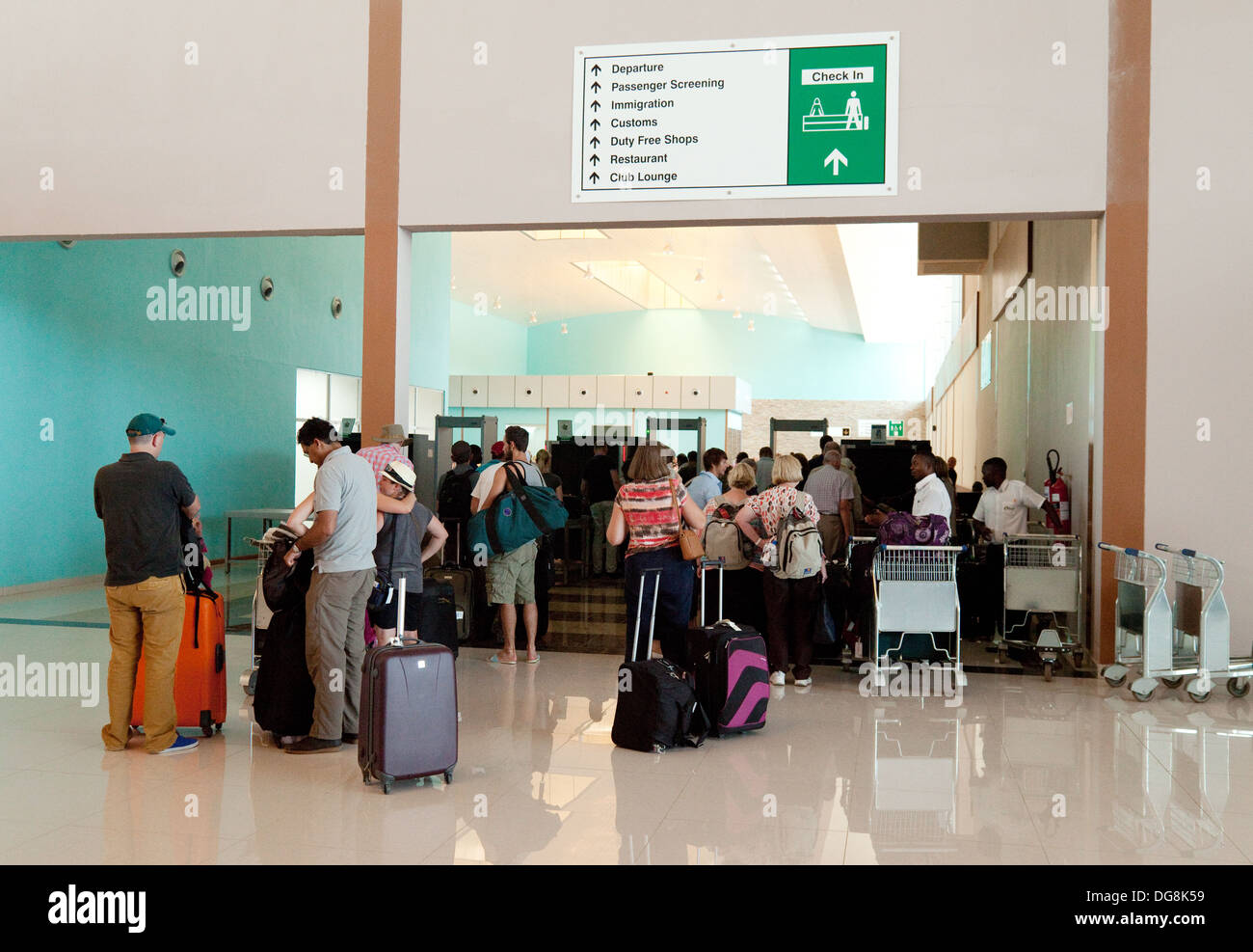 Air passengers going through security at Livingstone airport, Zambia, Africa Stock Photo