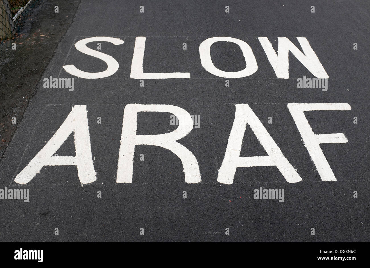 Bilingual Welsh Road Markings Slow (or Araf ) in Cardiff South Wales UK Stock Photo