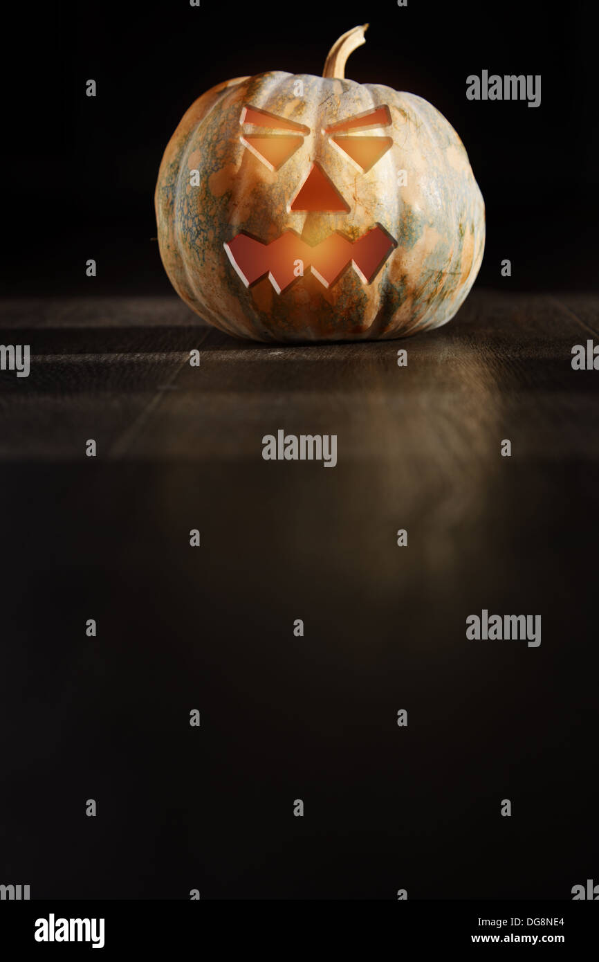 Halloween Pumpkin lantern in the dark room Stock Photo