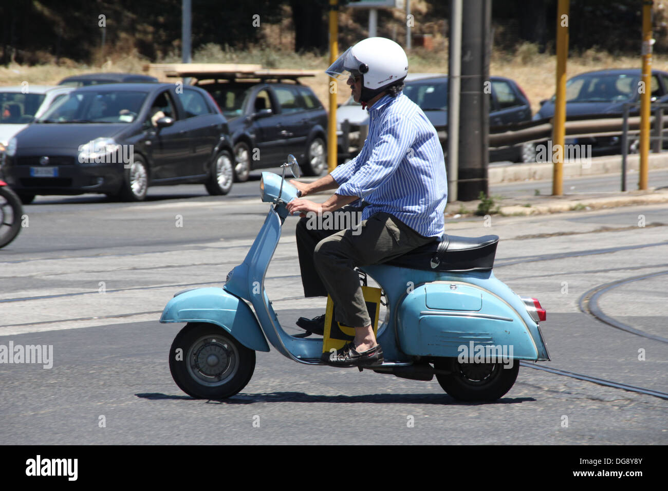 man riding old type vespa lambretta scooter in rome italy Stock Photo -  Alamy