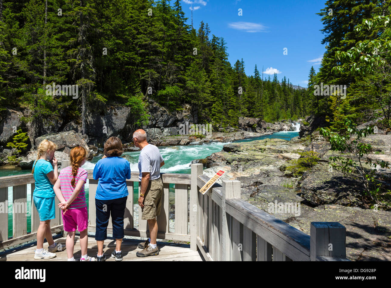 Tourists at McDonald Falls overlook, Glacier National Park, Montana, USA Stock Photo