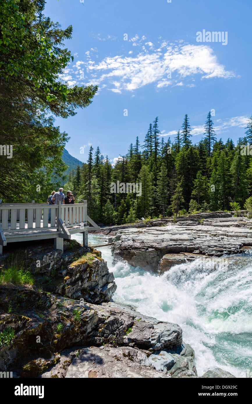 Tourists at McDonald Falls overlook, Glacier National Park, Montana, USA Stock Photo