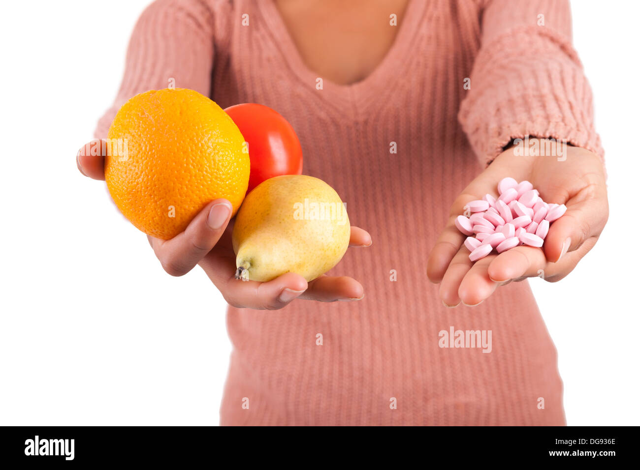 African woman and her choice - pills or fruit isolated Stock Photo