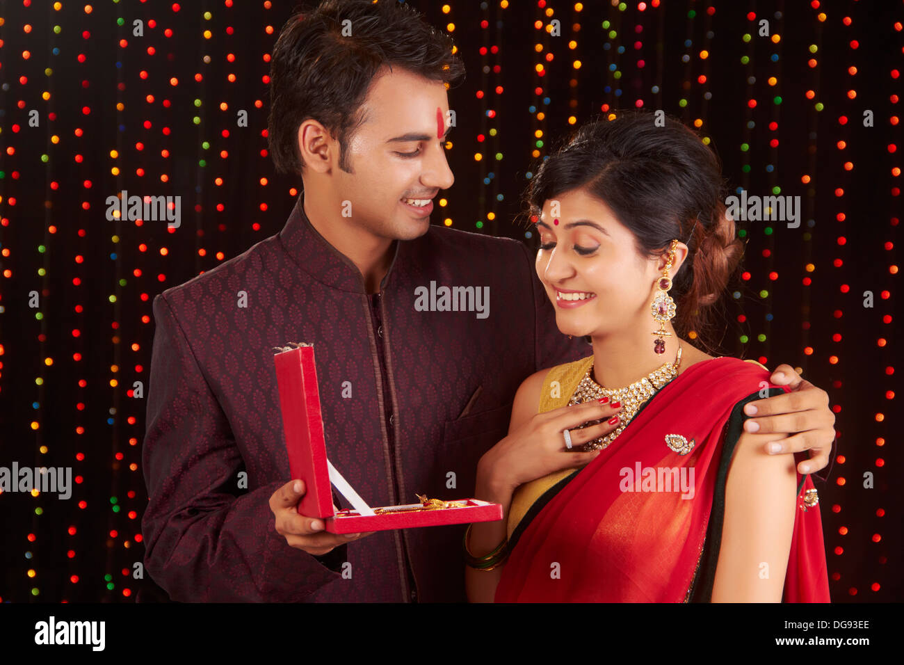 Indian man giving gift to woman on diwali Stock Photo