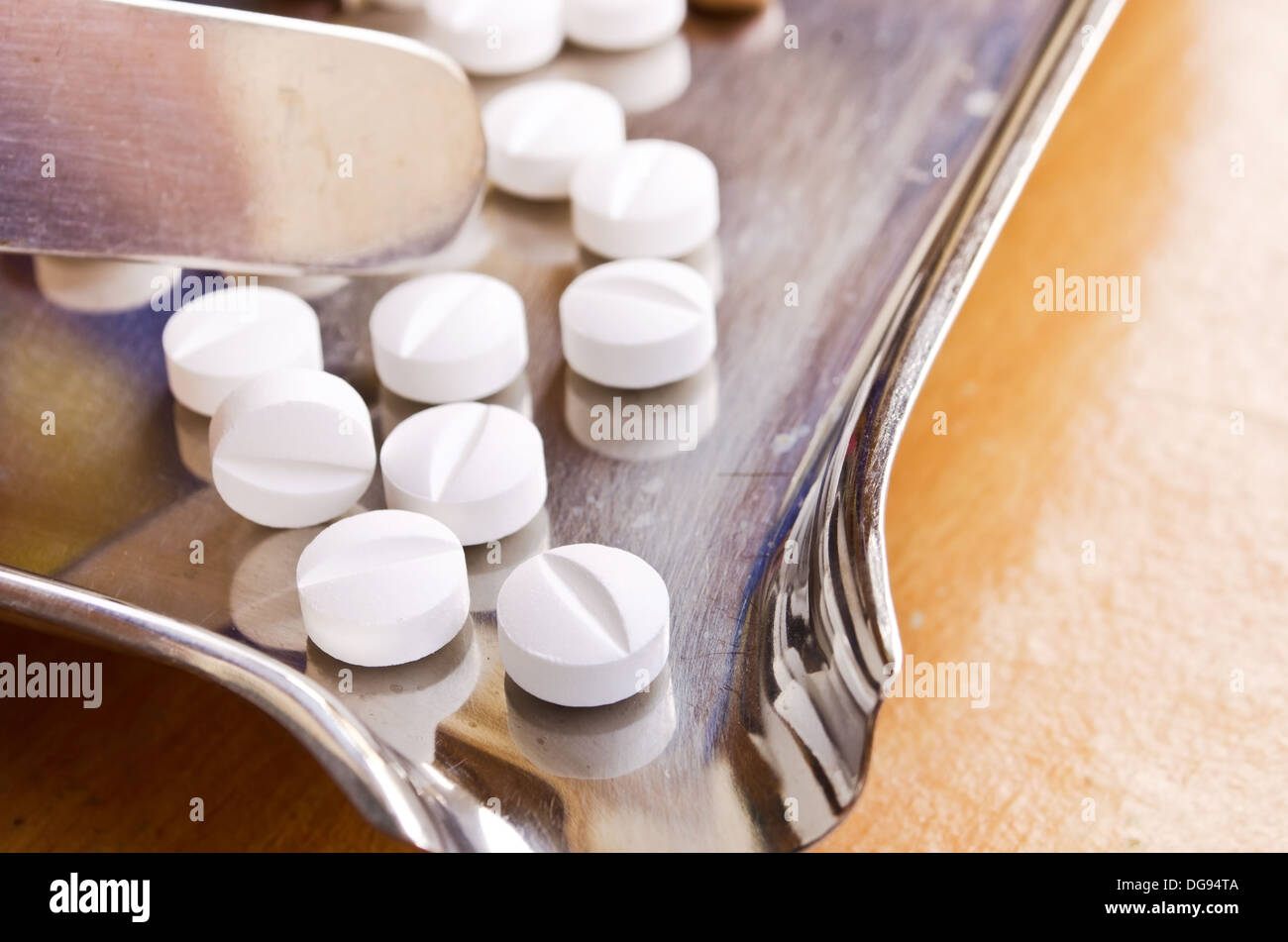 Close up of Counting tablets medical pills on stainless steel tray.(Health care and medical concept) Stock Photo