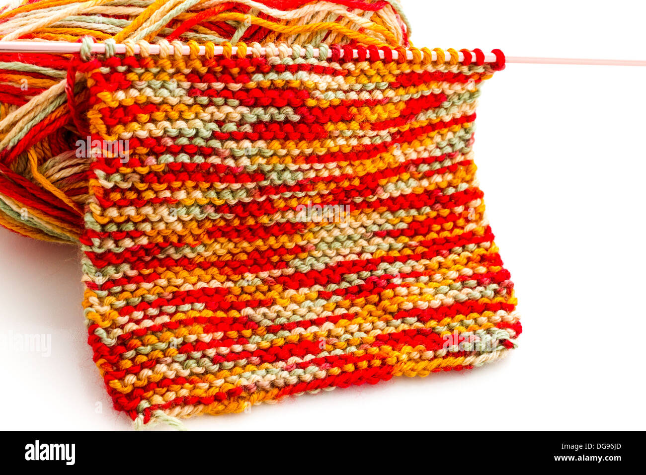 Knitting with multi colored yarn with orange, red, and yellow tones Stock  Photo - Alamy