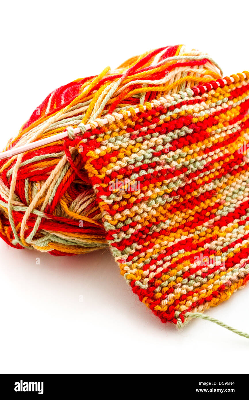 Knitting with multi colored yarn with orange, red, and yellow tones Stock  Photo - Alamy