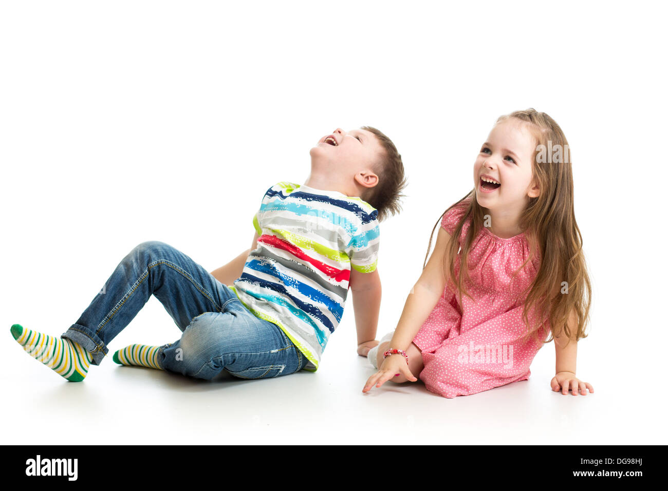 kids boy and girl laughing and looking up Stock Photo