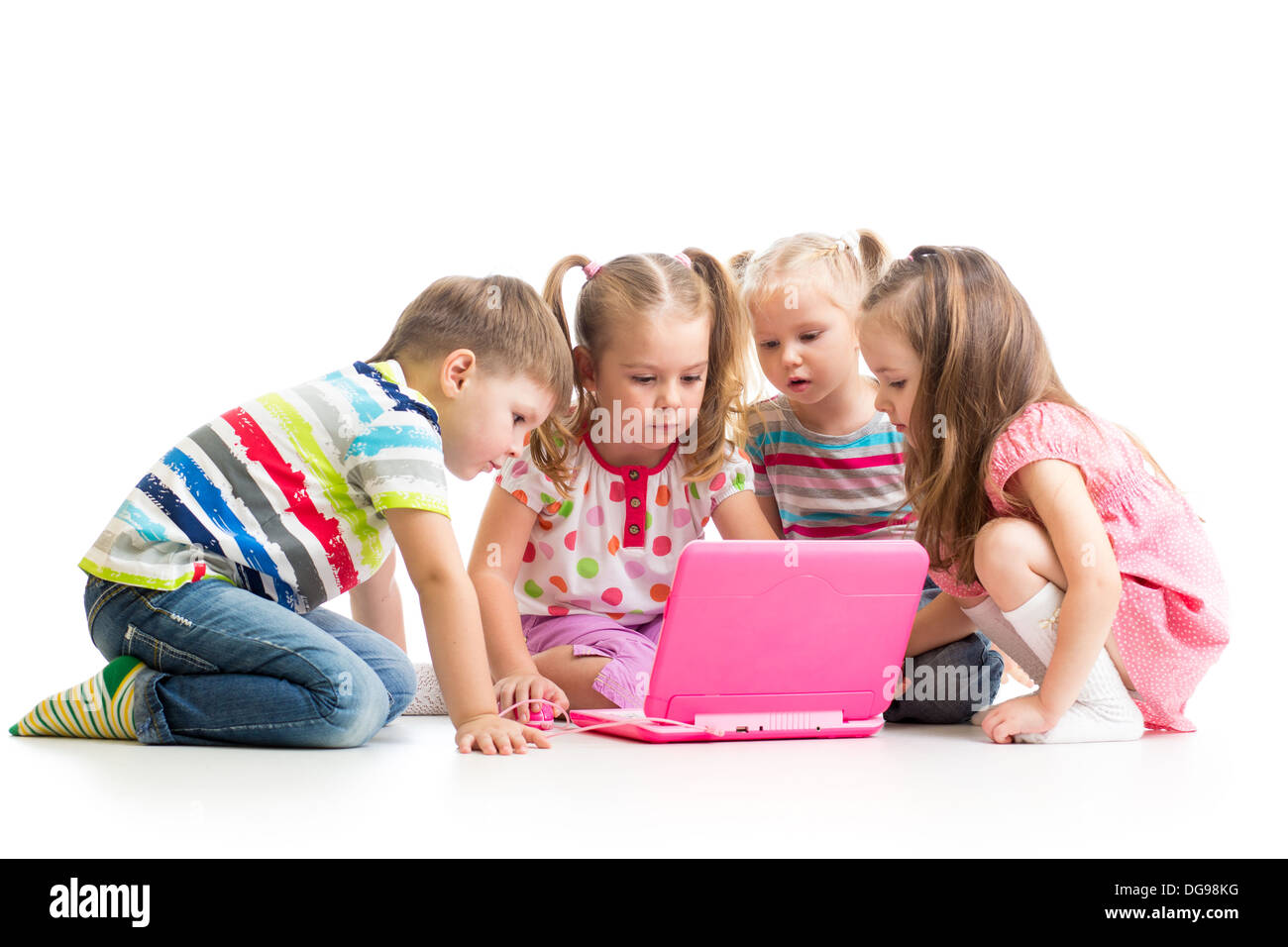 group of kids friends playing at the laptop Stock Photo