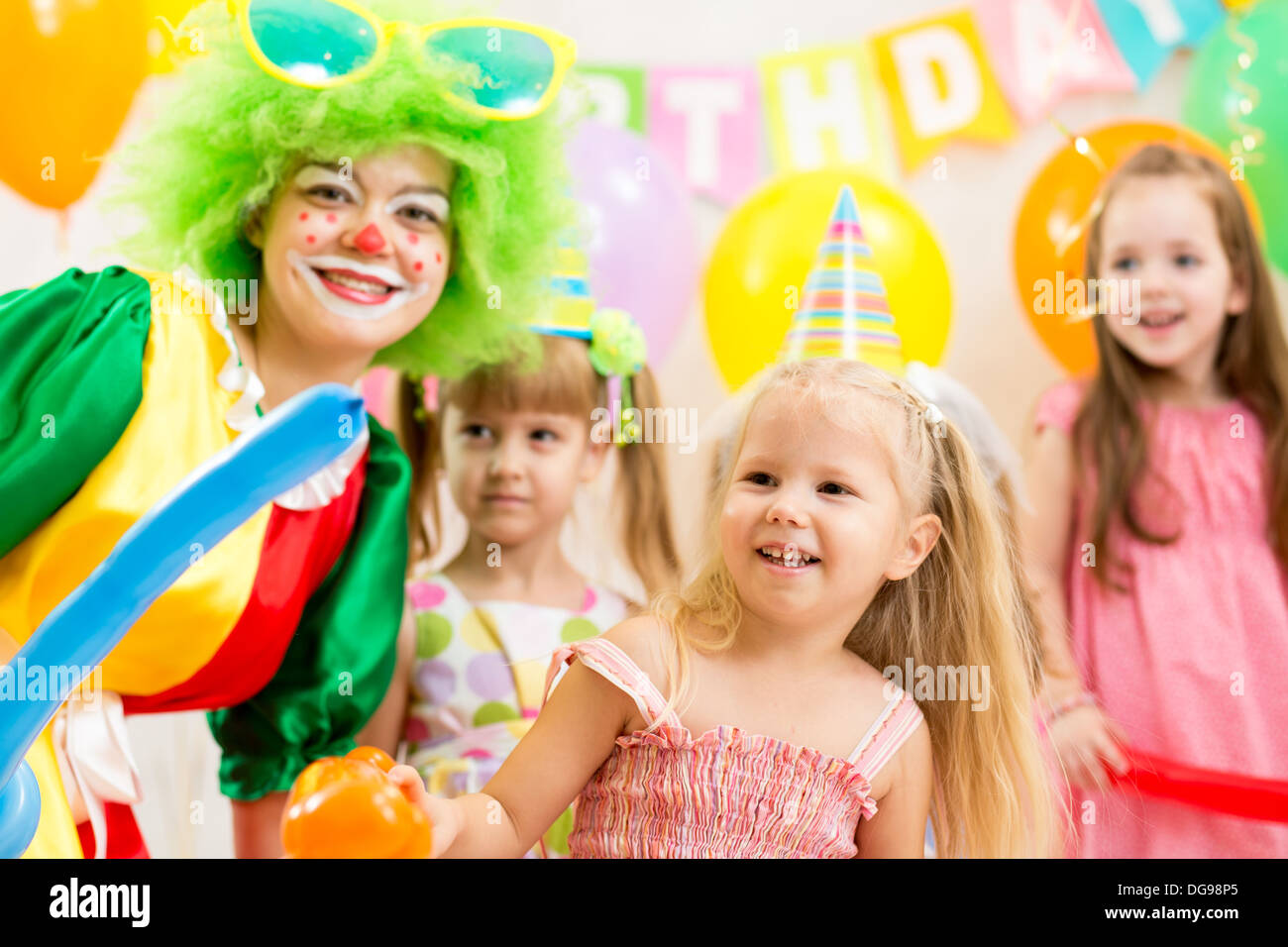kids group and clown on birthday party Stock Photo