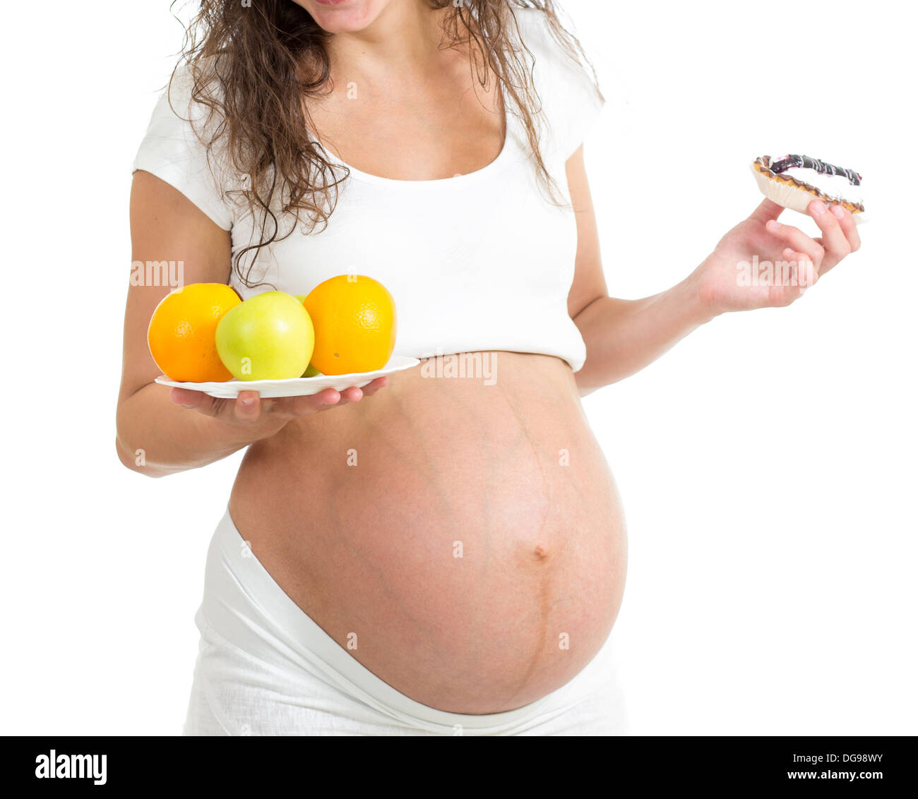pregnant woman choosing between healthy food fruits and cake ... pregnant woman choosing between healthy food fruits and cake ...