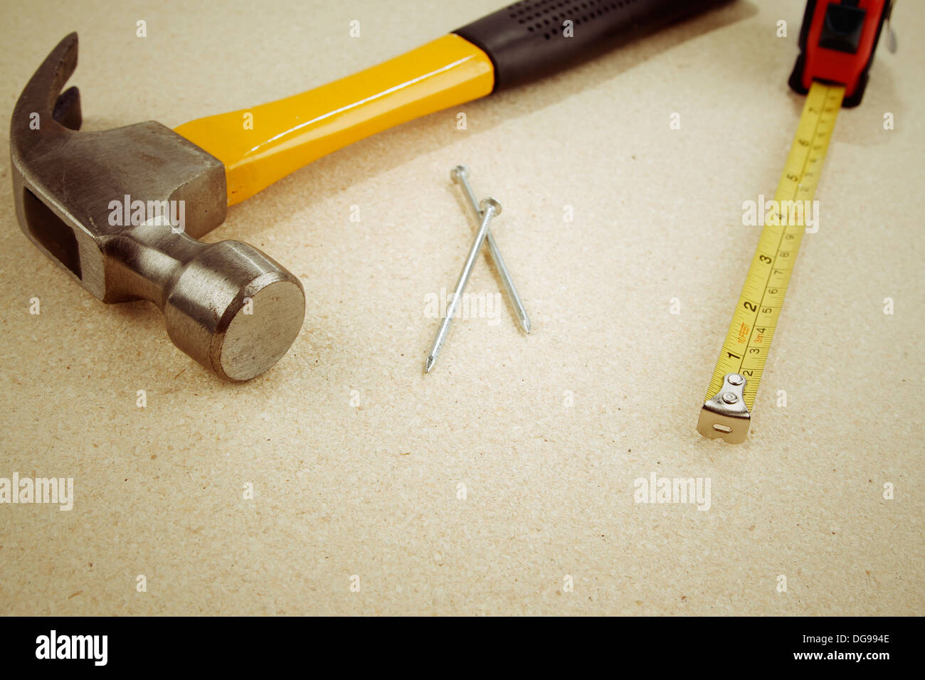 Hammer, nails and tape measure Stock Photo