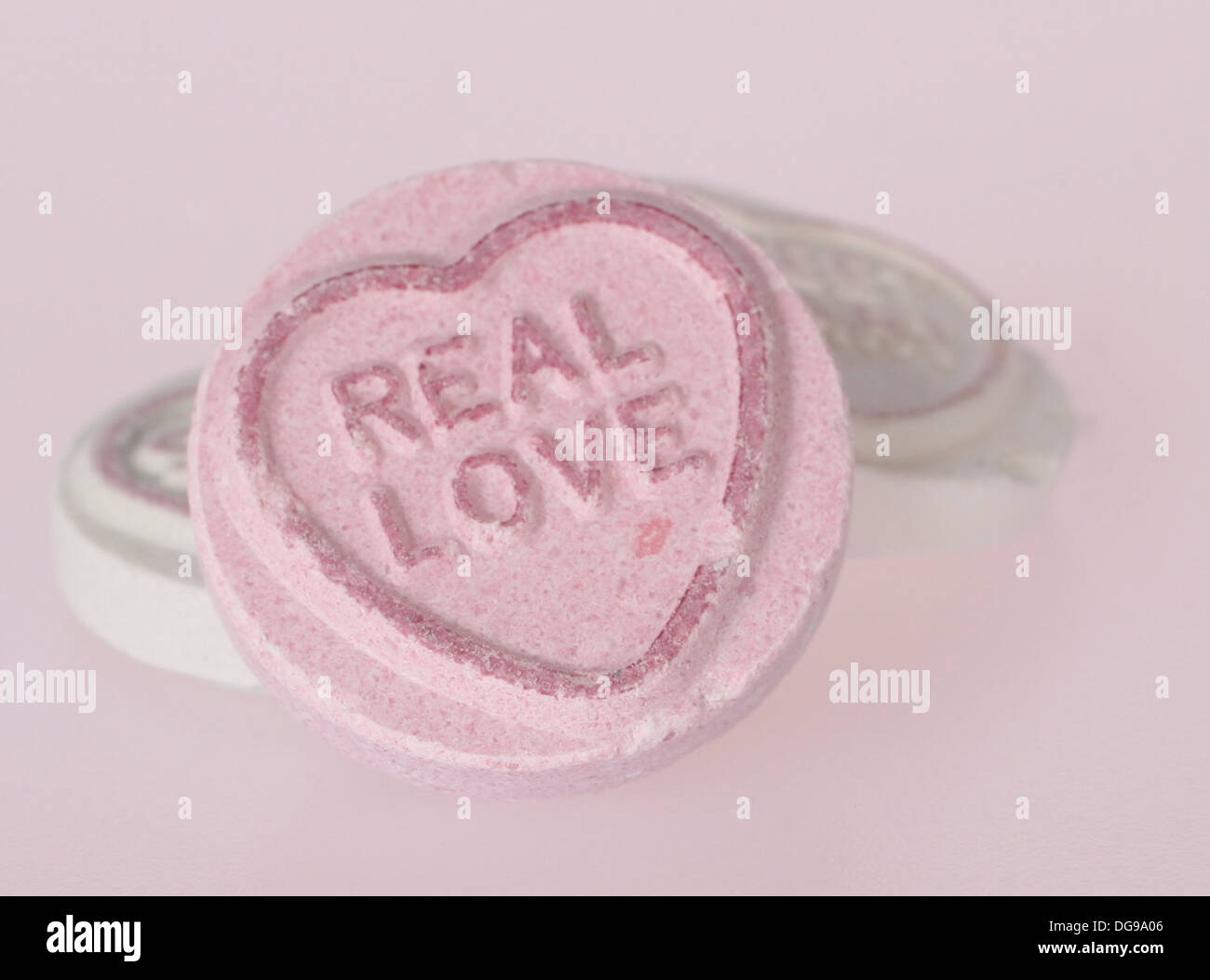Love Heart sweet with the message 'Real Love' Stock Photo