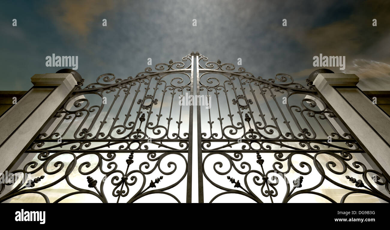 A set of closed ornate gates to heaven under an ethereal light and cloudy afterlife Stock Photo