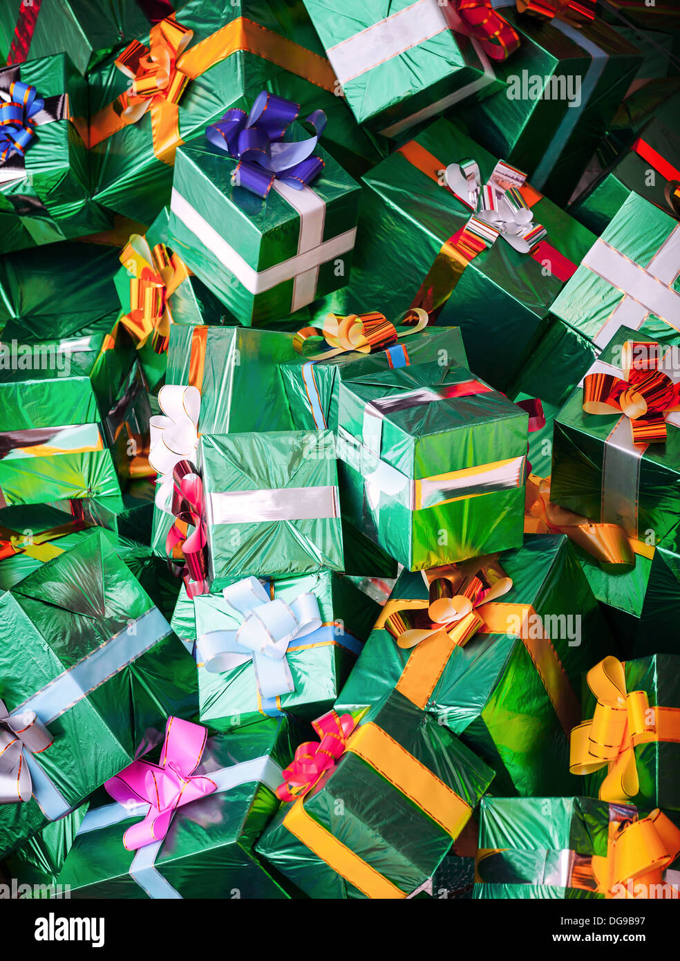 Photo background with huge pile of green shining gift boxes with ...