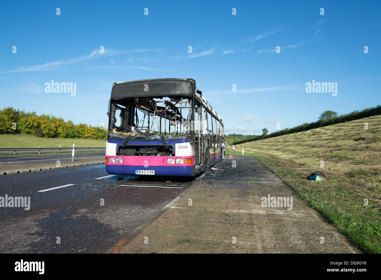 A130 Essex, UK. 17th Oct, 2013. Firefighters tackled a fire which saw a single decker bus catching light in the layby of the A130 between Howe Green and the Rettendon Turnpike. Wearing breathing apparatus and using two hose reel jets and one main jet firefighters  extinguished the blaze. No injuries were reported in the incident but long queues formed on the A130 back to the A12. Credit:  Allsorts Stock Photo/Alamy Live News Stock Photo