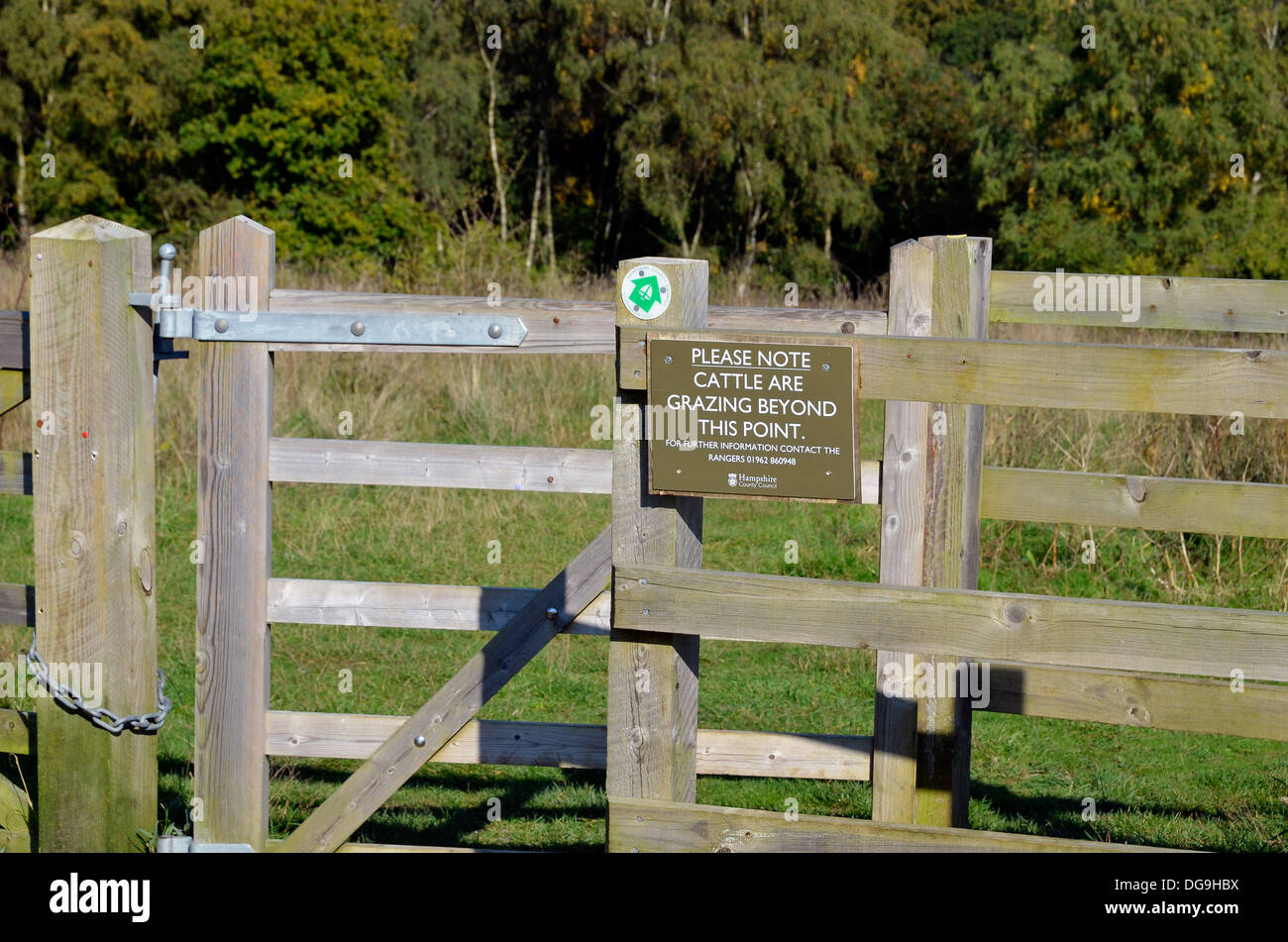 Kissing gate, field gate and warning notices where cattle are grazed for land management, Farley Mount Country Park,Winchester Stock Photo